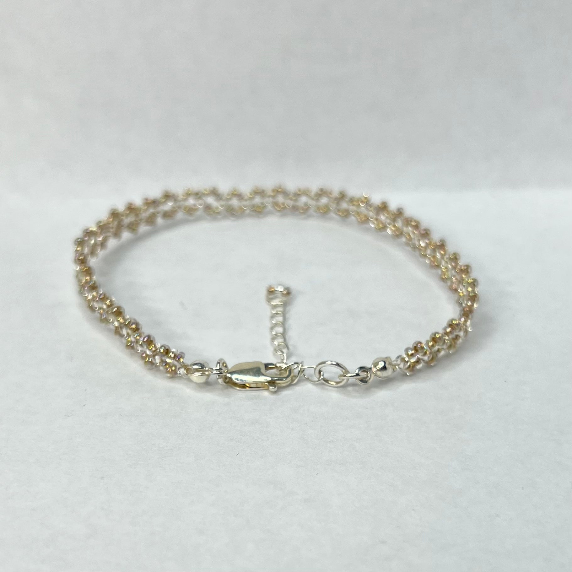 Silver bracelet on a white background