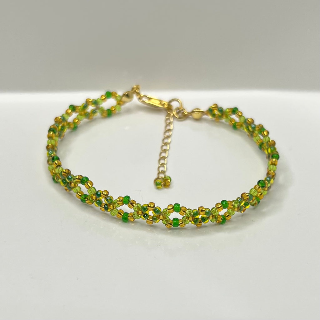 Green beaded bracelet on a white background