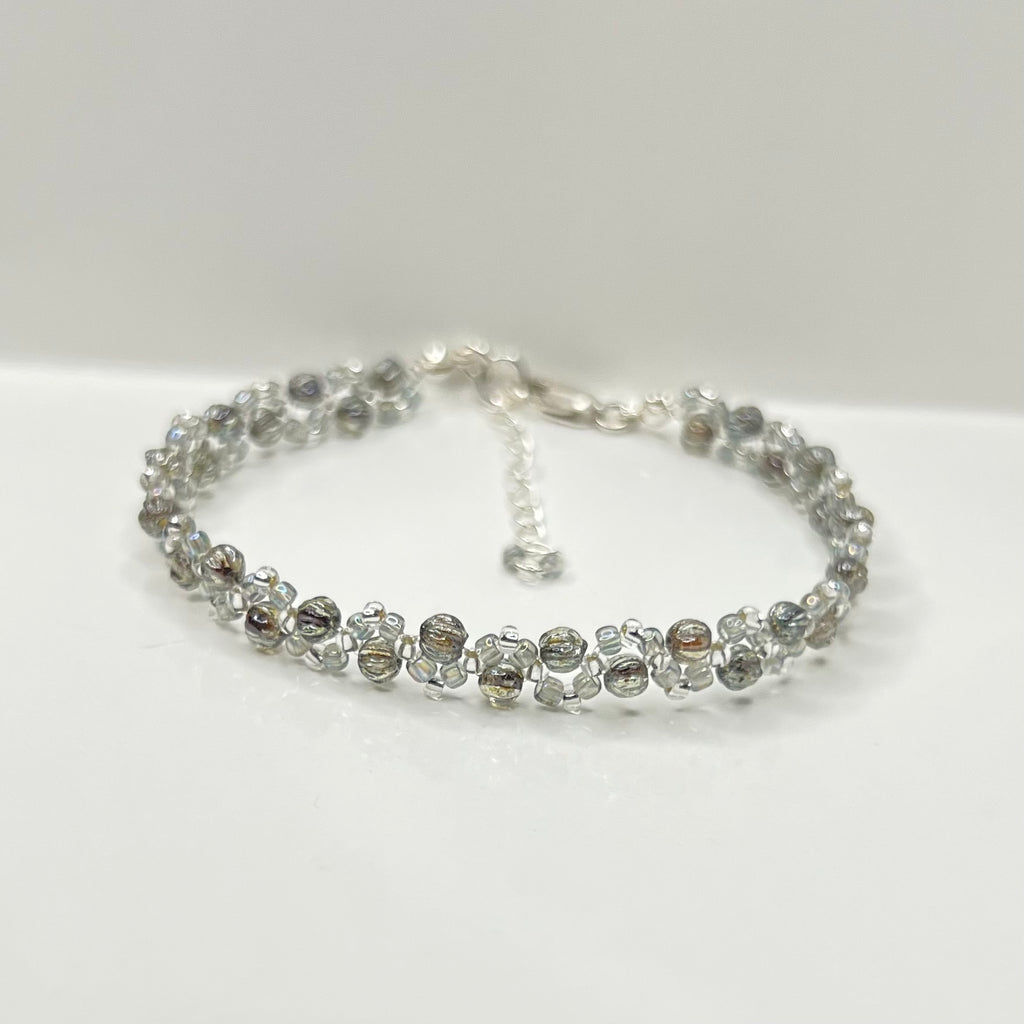Silver beaded bracelet on a white background
